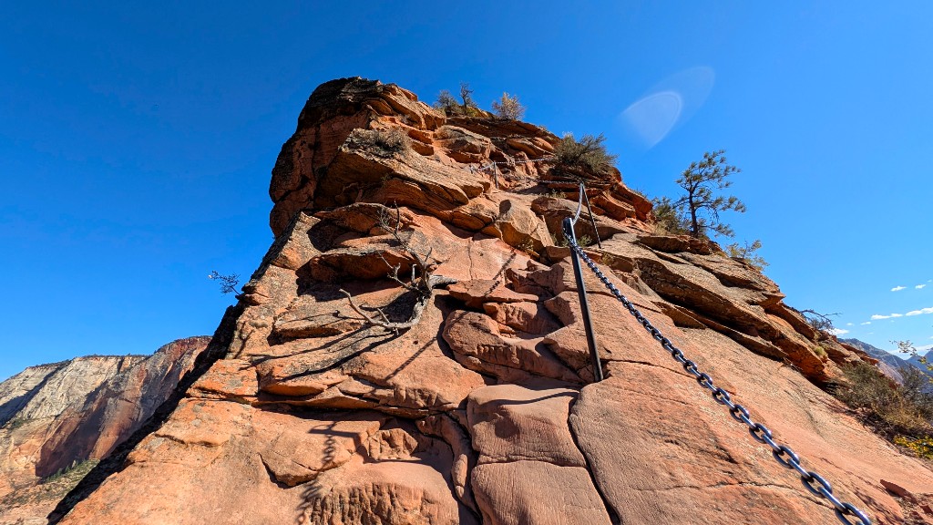 Safety chain bolted into steep red sandstone on Angels Landing