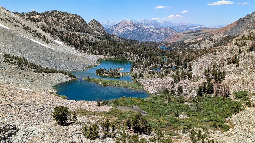 View from Duck Pass back toward the trailhead with alpine lakes and the Eastern Sierra stretching into the distance