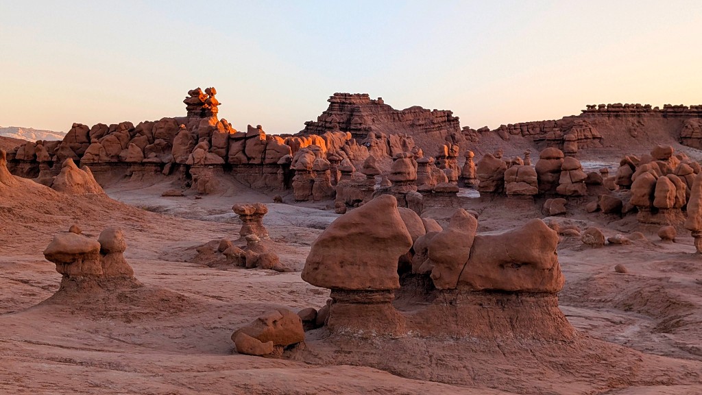 Sandstone hoodoo formations at sunset in Goblin Valley State Park, Utah
