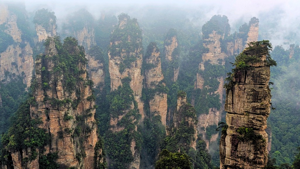 Sandstone pillars rising through morning mist at Zhangjiajie National Forest Park